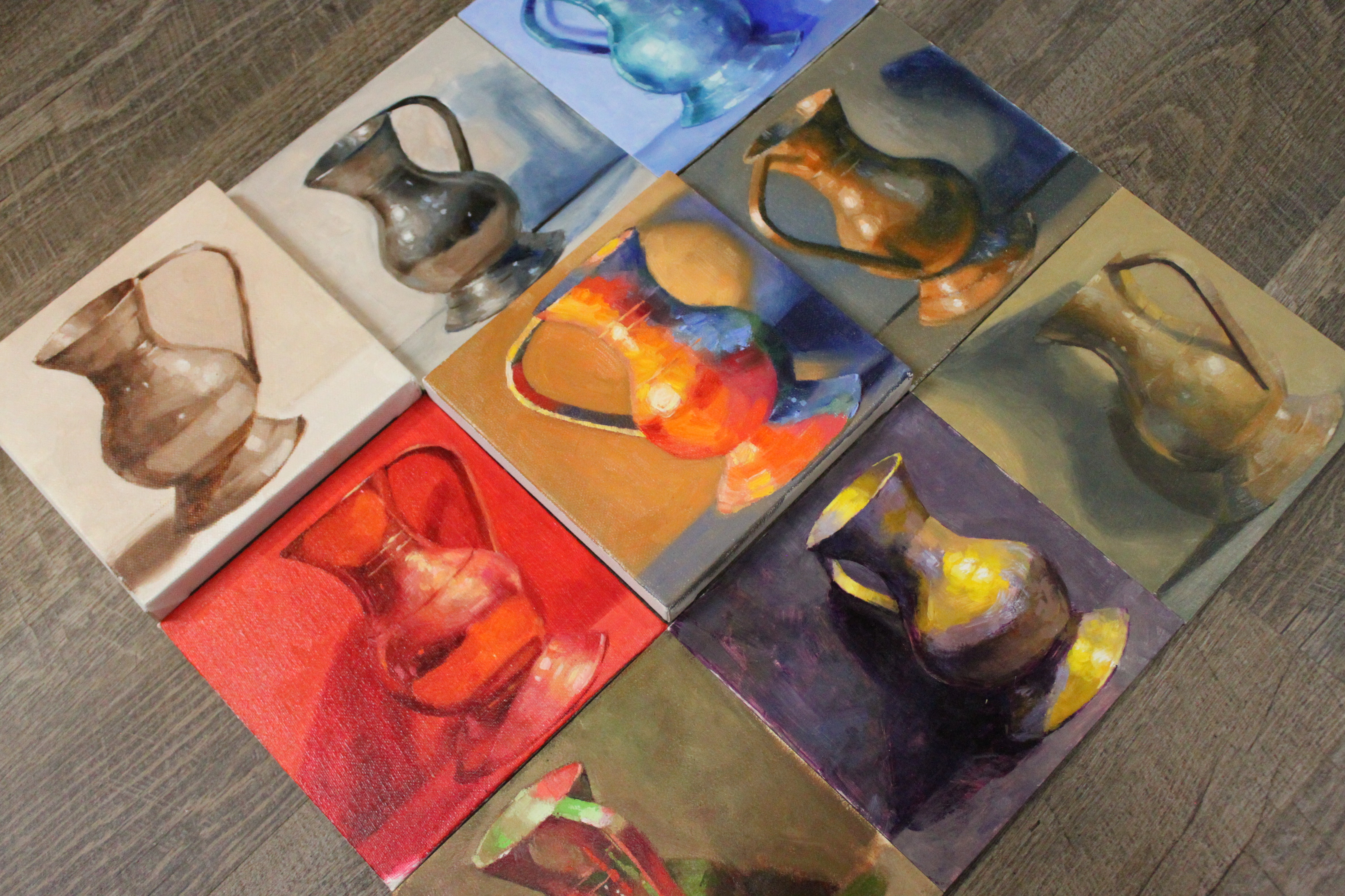 photo of several paintings of the same subject, each painted using a different color palette or gamut