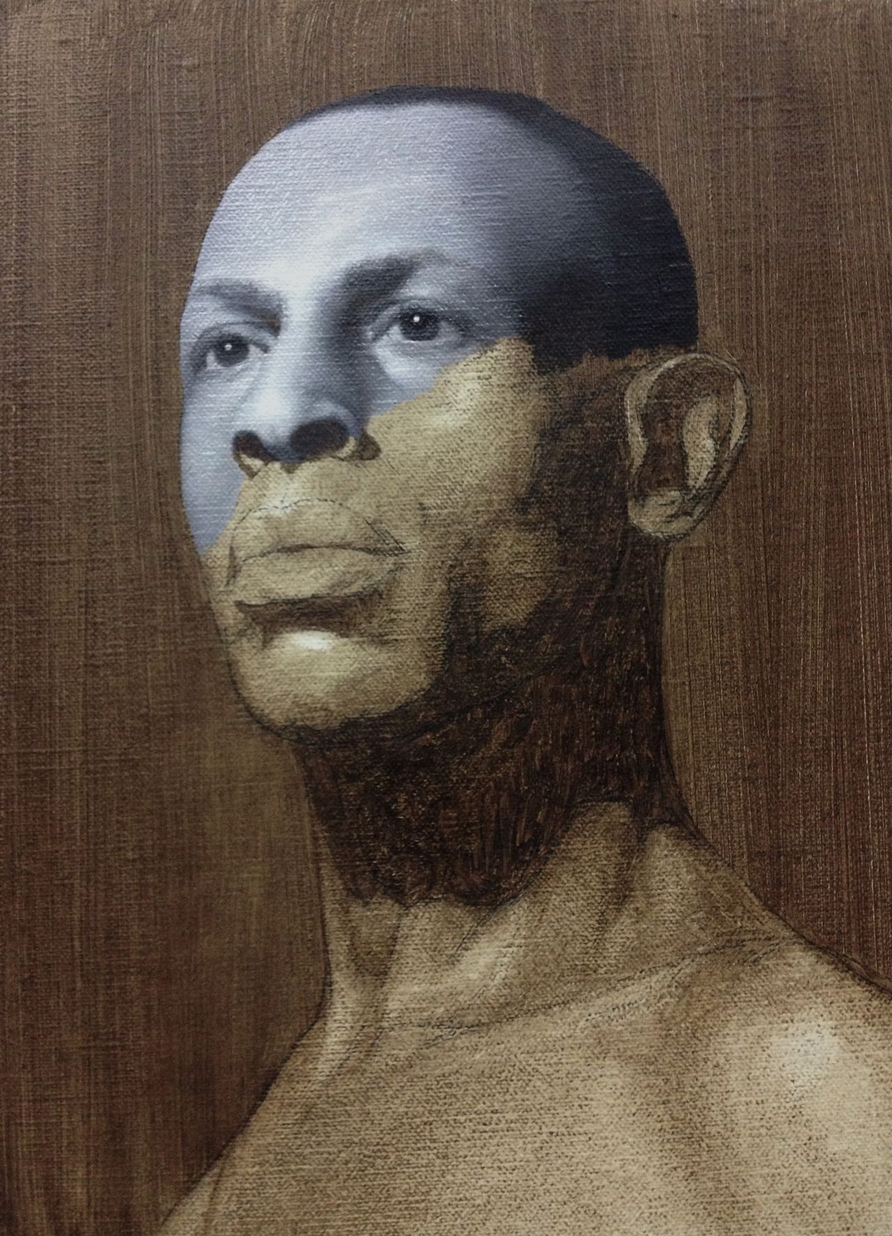 image of a painting in progress showing a partially completed grisaille layer over an imprimatura layer. The subject is the portrait of a man.